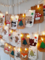Preview: Handgemachter Adventskalender mit Waldtieren – 24 Papiertüten in Weiß & Braun
