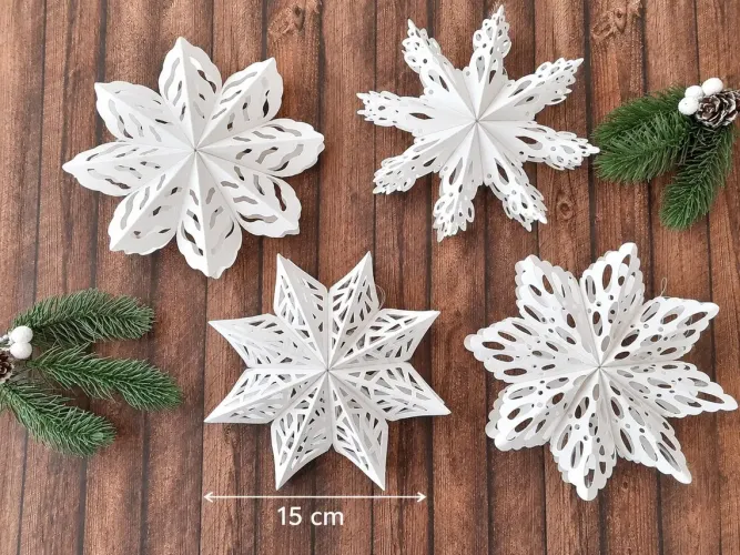 Preview: 4er Set Papier-Schneeflocken mit Magnetverschluss – Weihnachtsdeko zum Aufhängen, Fensterdeko